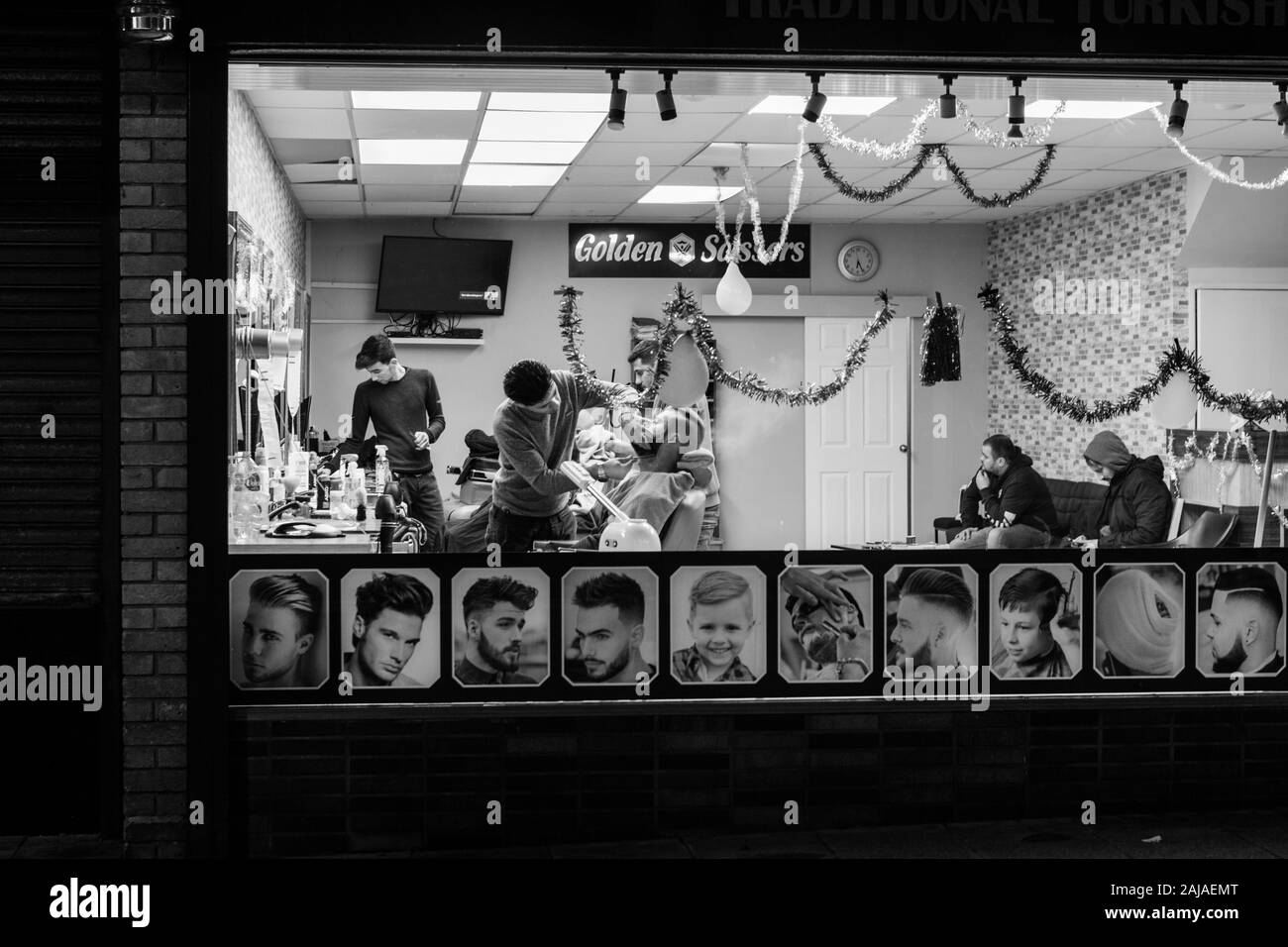 Street scene of traditional Turkish barber shop window with client ...