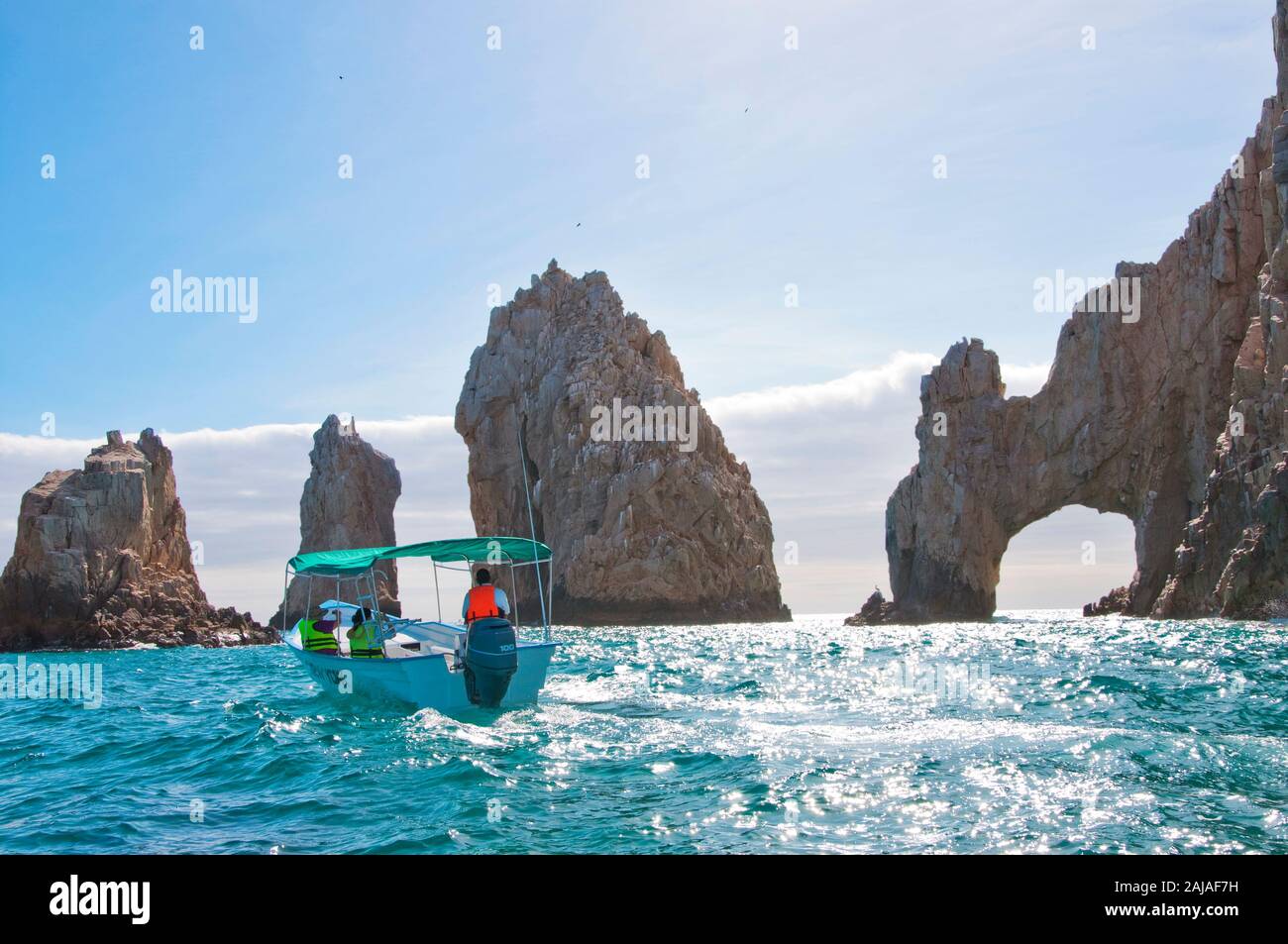 Boat by the famous rock arch in Cabo San Lucas Stock Photo