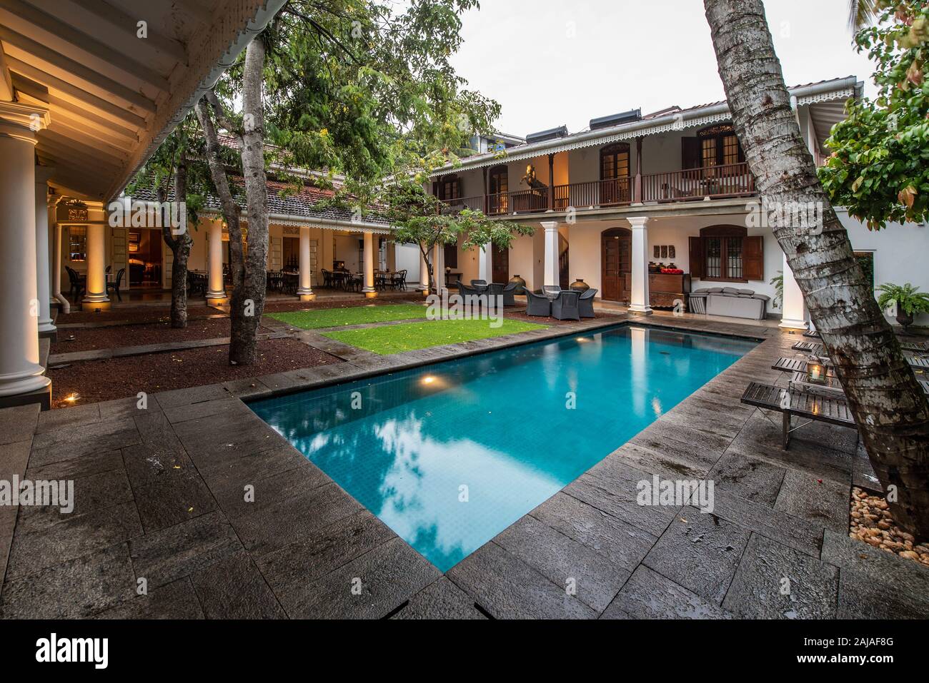 swimming pool in the court yard of a colonial style boutique hotel Stock Photo