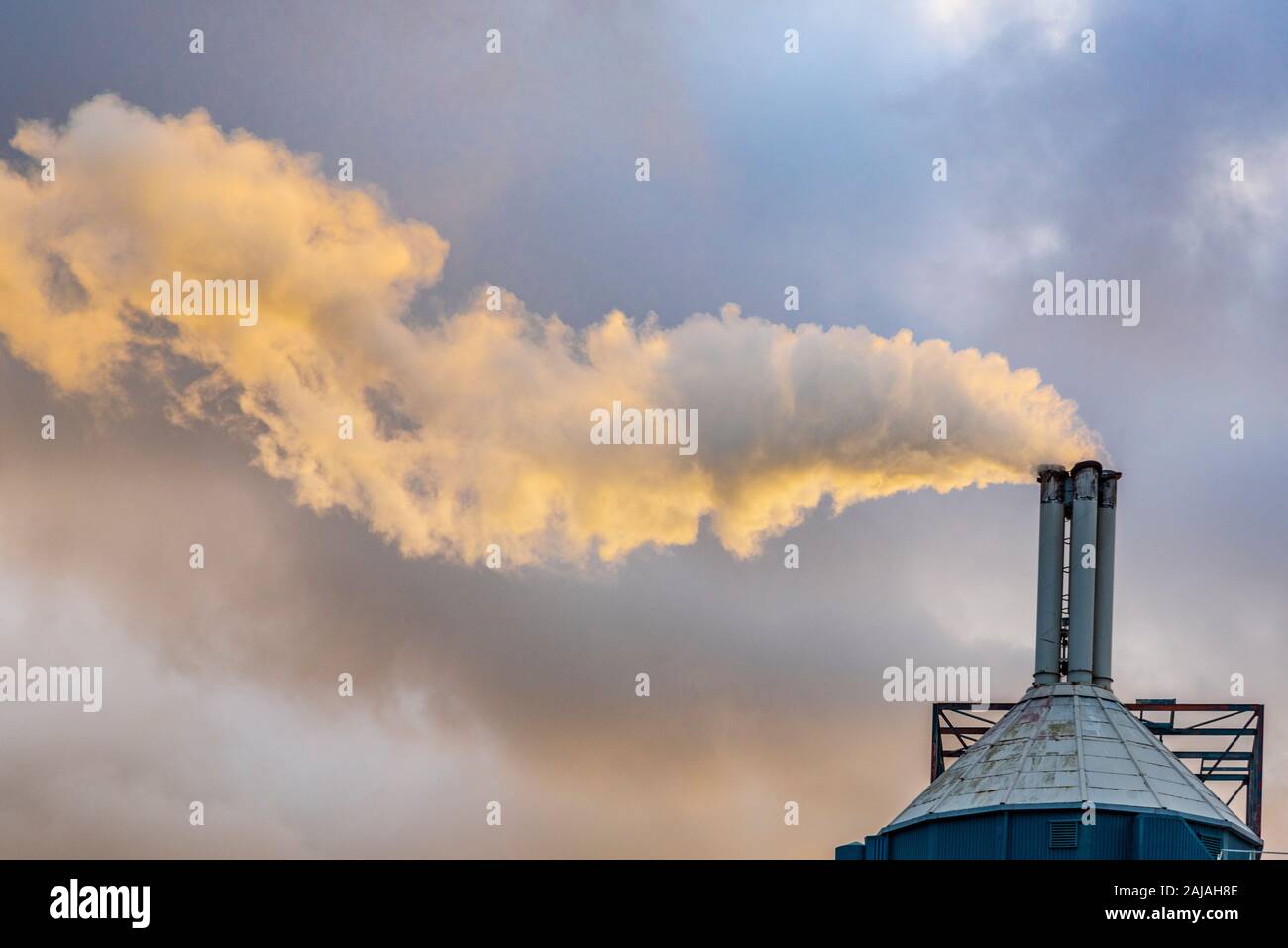 Unilever factory at Warrington Bank Quay. Smoking chimney. Stock Photo
