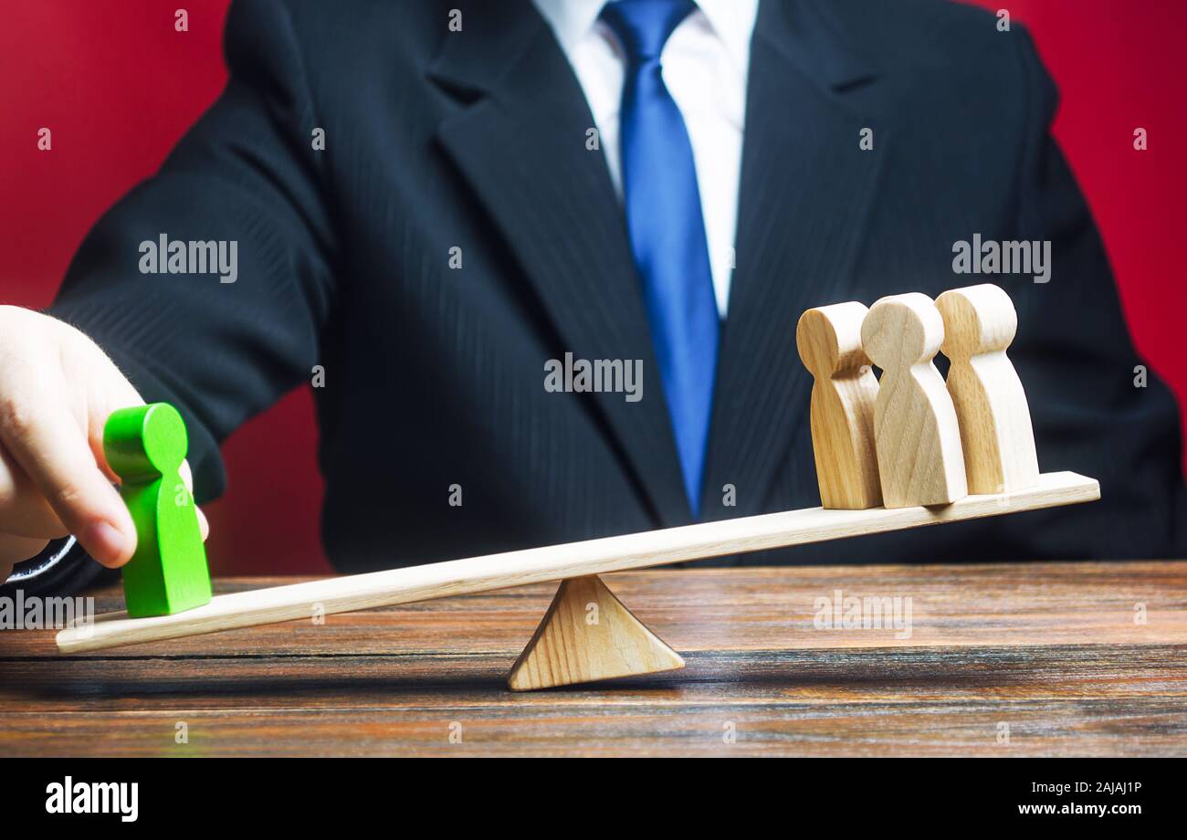 A businessman outweighs a specialist over a group of people