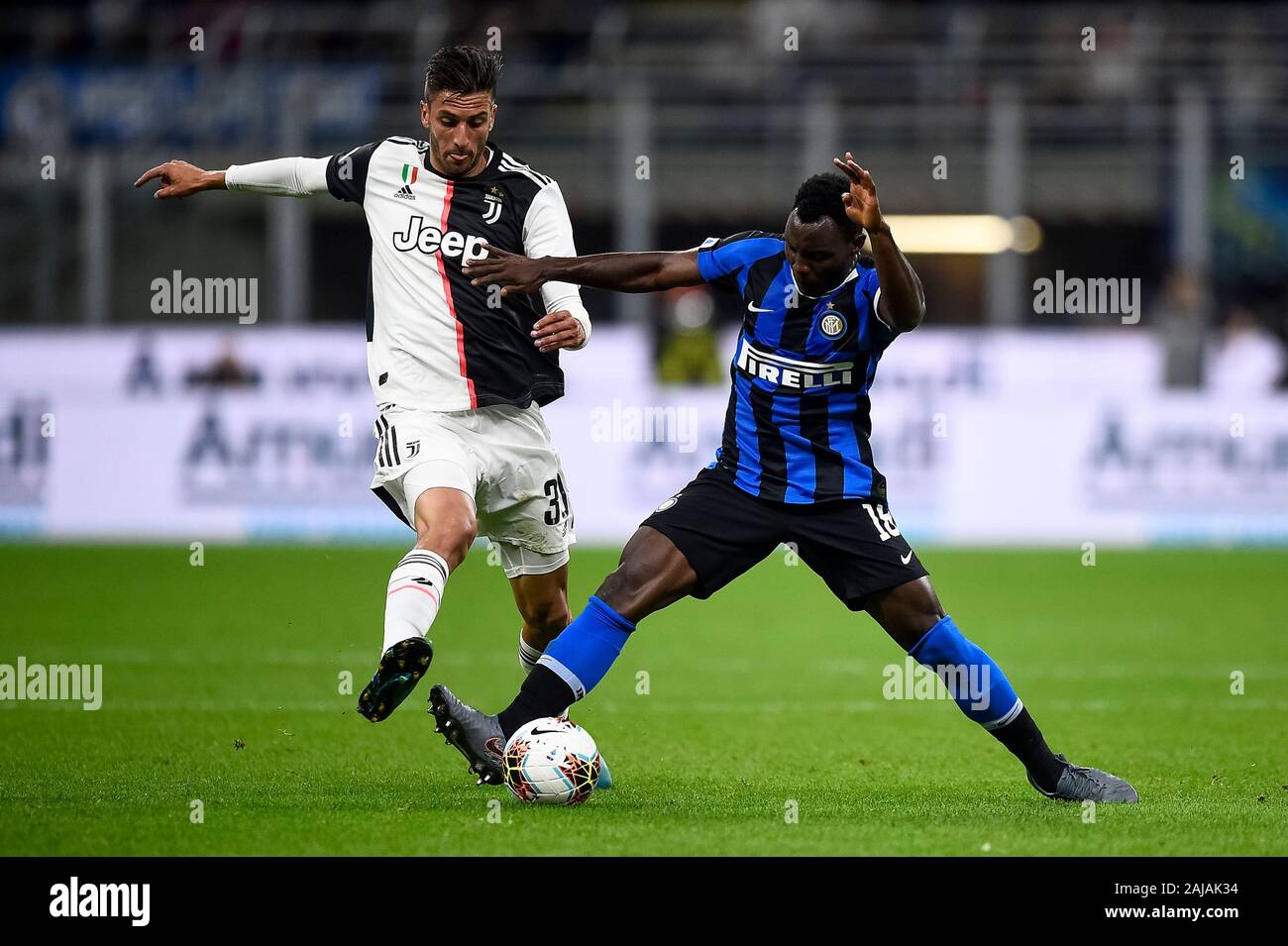 Milan, Italy. 6 October, 2019: Kwadwo Asamoah (R) of FC Internazionale competes for the ball with Rodrigo Bentancur of Juventus FC during the Serie A football match between FC Internazionale and Juventus FC. Juventus FC won 2-1 over FC Internazionale. Credit: Nicolò Campo/Alamy Live News Stock Photo