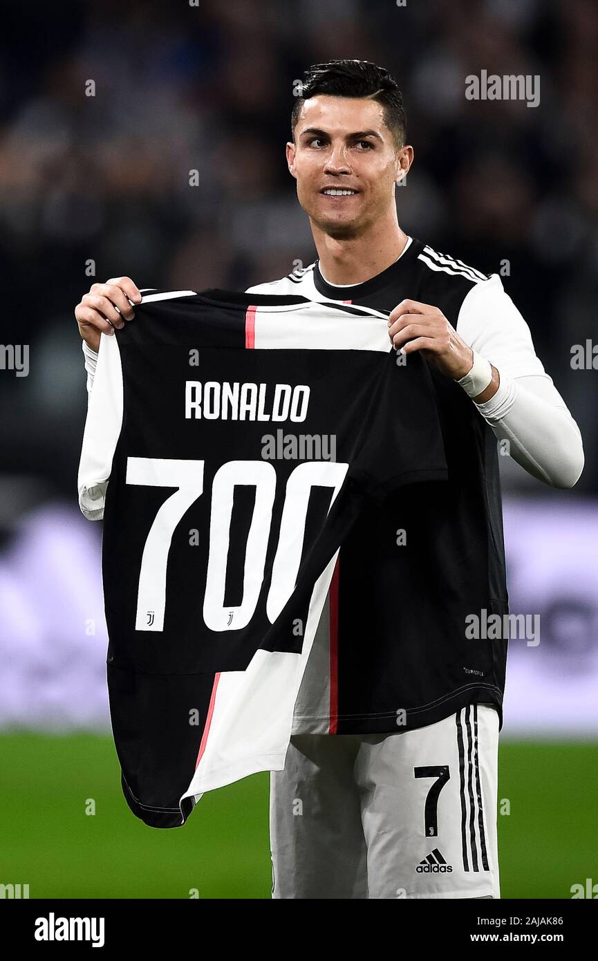 Turin, Italy. 19 October, 2019: Cristiano Ronaldo of Juventus FC holds a  jersey with the number 700 after being honoured for having scored 700 goals  during his career prior to the Serie