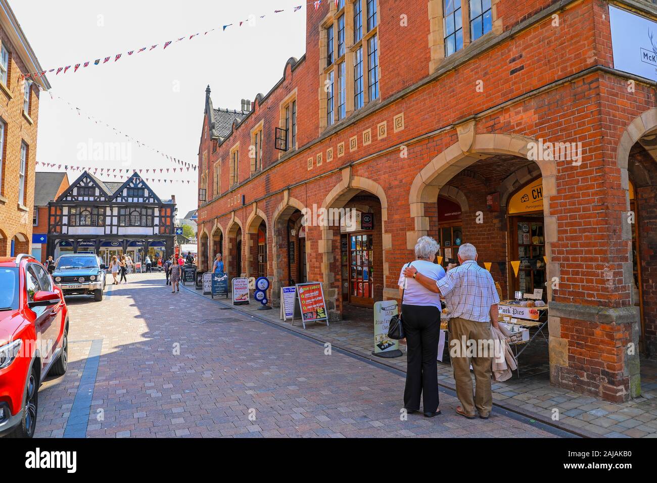 An elderly couple in Conduit Street, Lichfield, Staffordshire, England