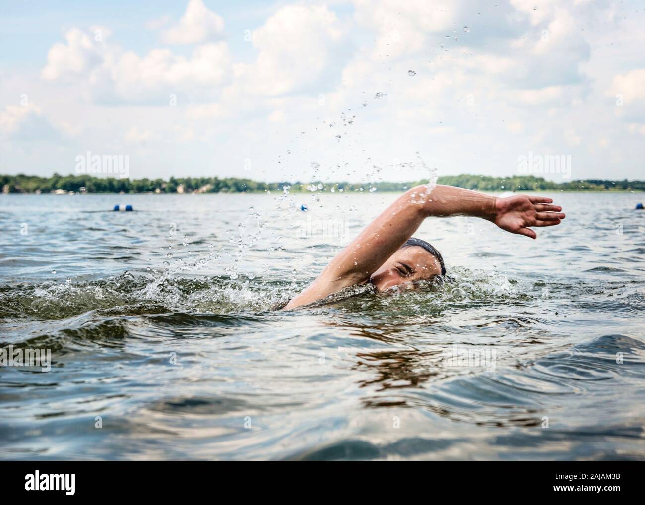Young Girl Swimming in a Lake Stock Photo