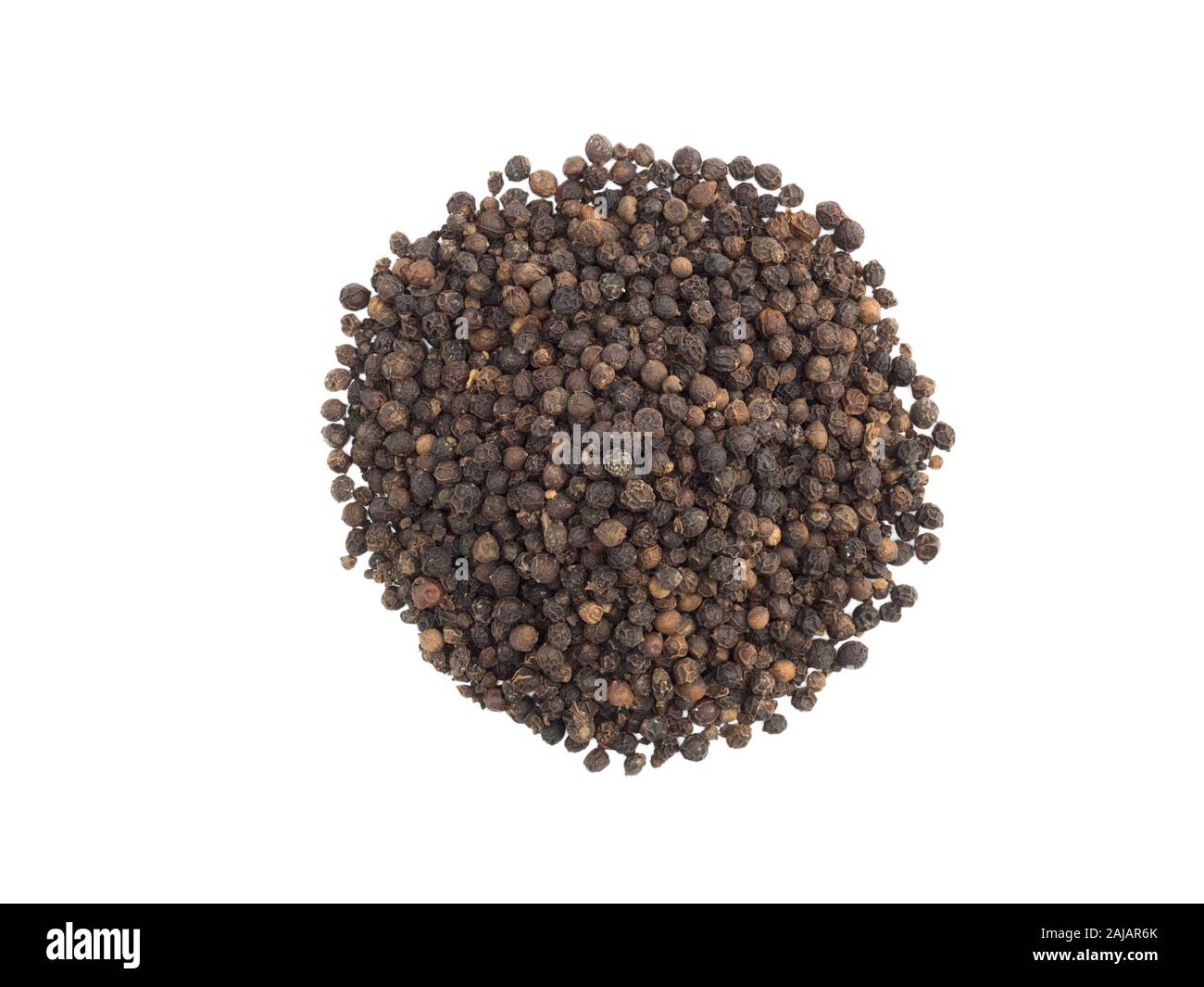 A round bunch of black pepper on white isolated background. Indian