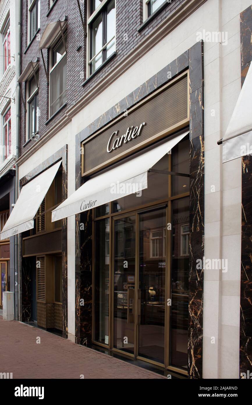 View of store of French jewellery and watch manufacturer's store on on luxury shopping street named 'Pieter Corneliszoon Hooft' in Amsterdam. It is a Stock Photo