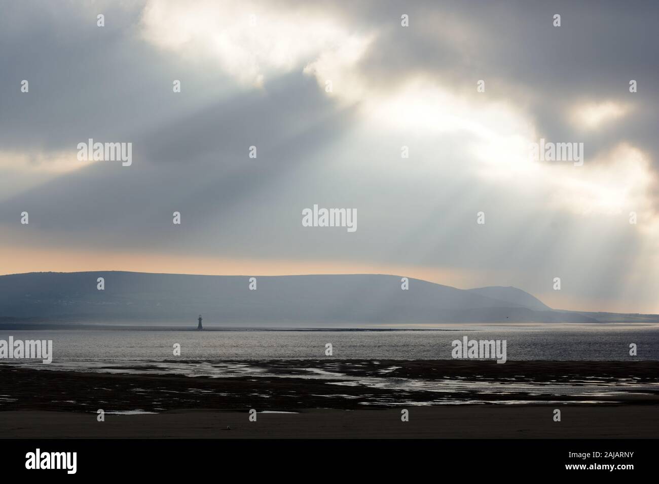 Shafts of light over Whiteford and Gower Peninsula Wales Cymru UK Stock Photo