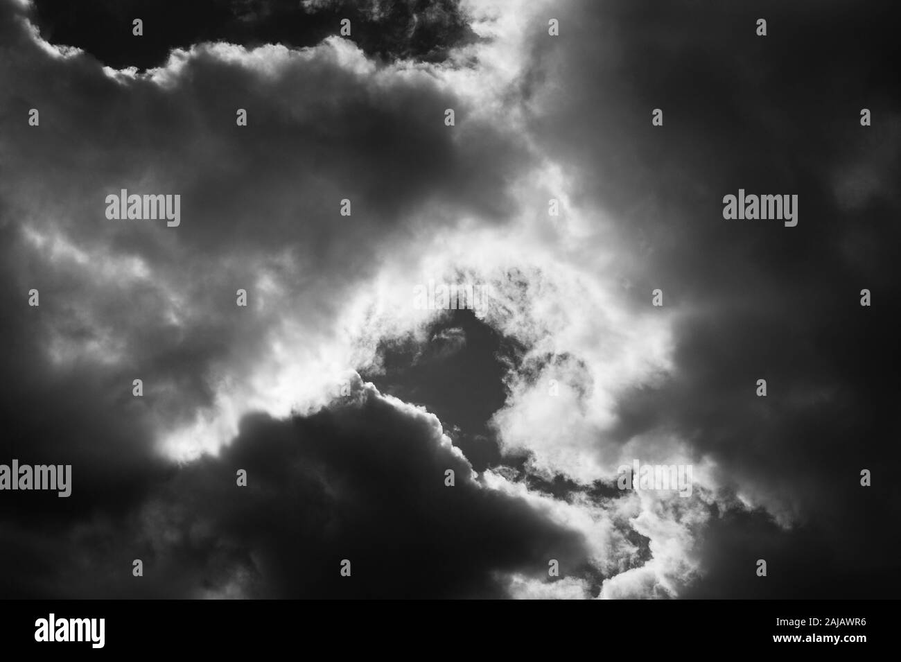 Cumulus congestus clouds rain likely in black and white Stock Photo - Alamy