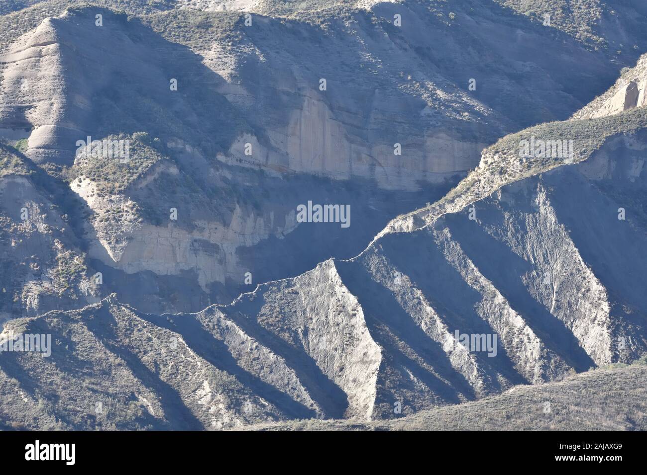 Large scars in the southern desert hills due to erosion Stock Photo