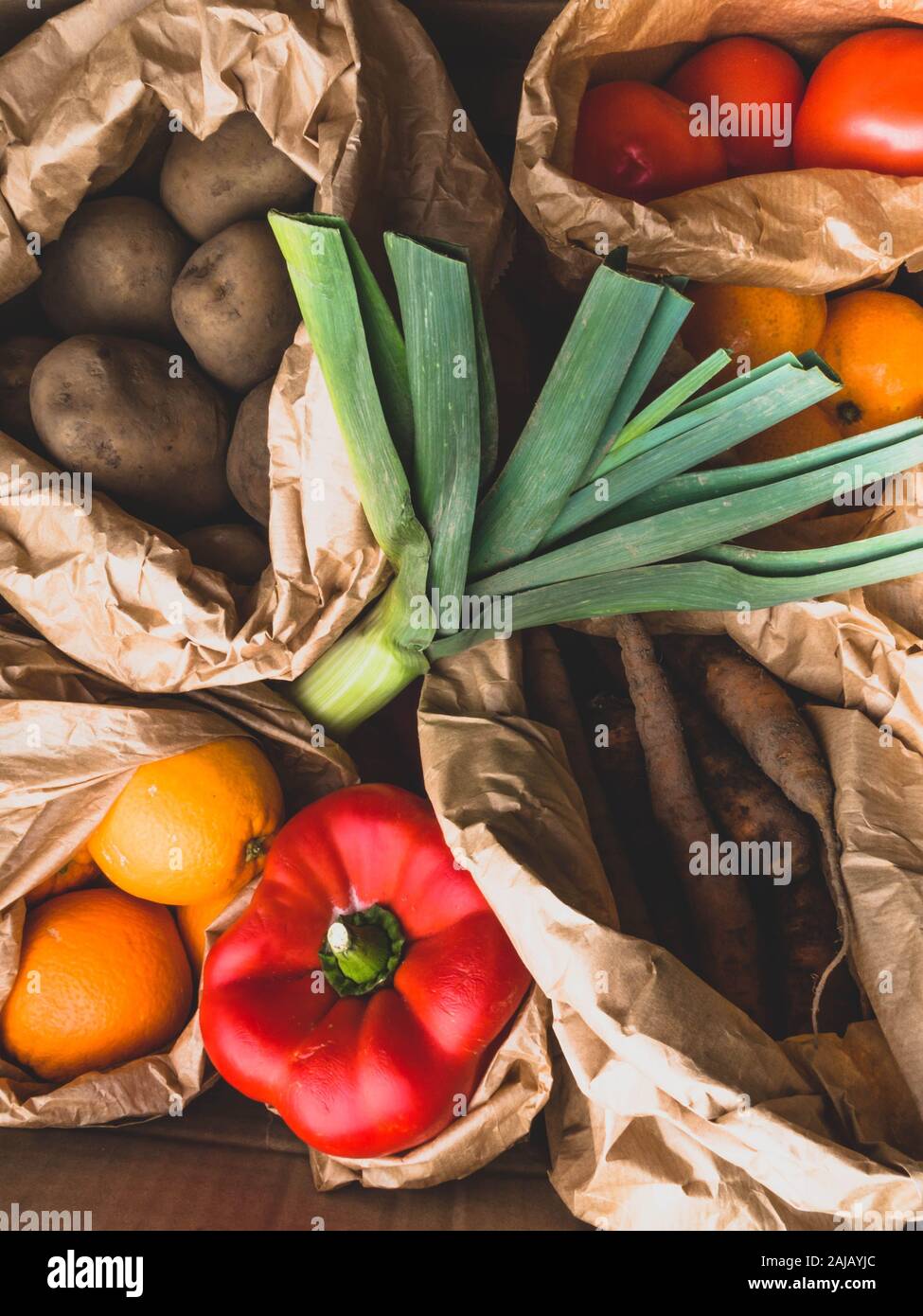 natural on a eco friendly paper bags full of vegetables and fruits