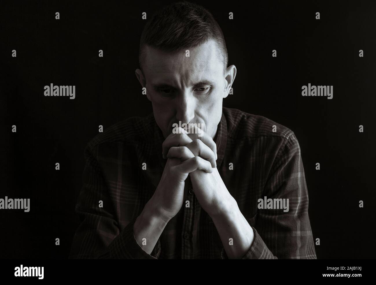 A man experiences depression during a crisis. Stock Photo