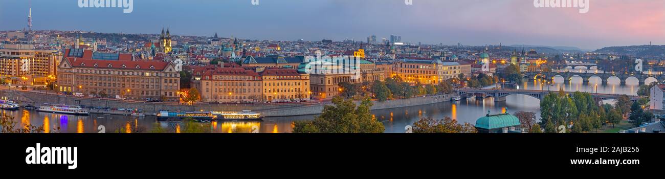 Prague - The panorama of the city with the bridges at dusk. Stock Photo