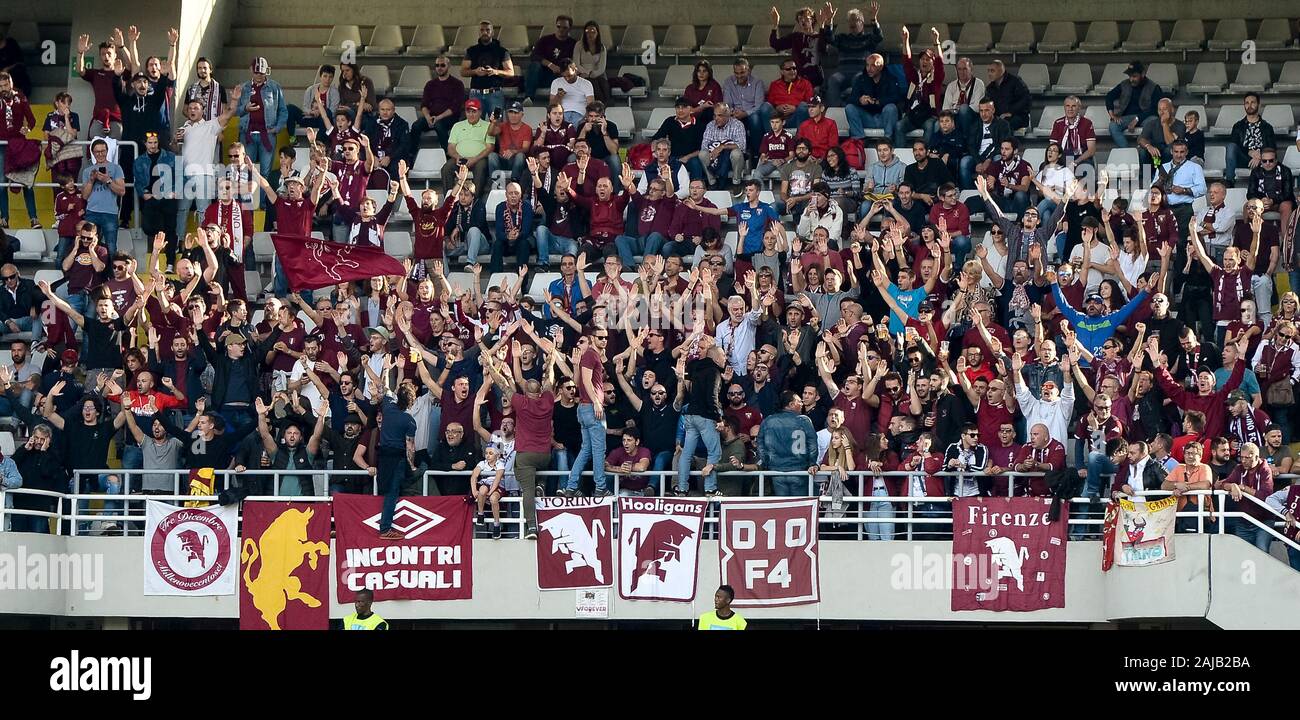 Turin, Italy - 27 October, 2019: Torino fans in sector 'Curva Primavera' show their support behind the banner 'Torino Hooligans' during the Serie A football match between Torino FC and Cagliari Calcio. The match ended in a 1-1 tie. On 11 december 2019, 75 ultras belonging to the 'Torino Hooligans' group received DASPO (ban on access to sporting events to prevent violence at stadiums) and 71 were reported for violent crimes. Credit: Nicolò Campo/Alamy Live News Stock Photo