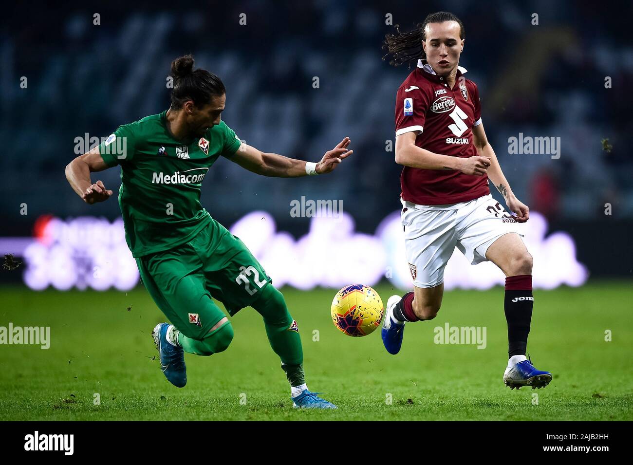 Turin, Italy - 08 December, 2019: Diego Laxalt (R) of Torino FC is challenged by Martin Caceres of ACF Fiorentina during the Serie A football match between Torino FC and ACF Fiorentina. Torino FC won 2-1 over ACF Fiorentina. Credit: Nicolò Campo/Alamy Live News Stock Photo