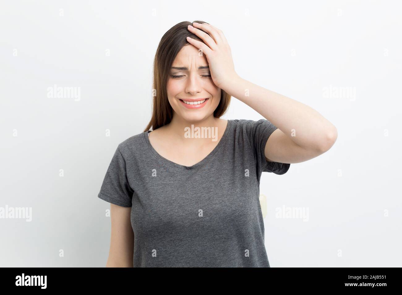 A distressed woman is crying emotionally. Depressed state in a girl. Stock Photo