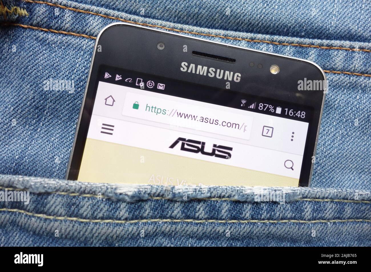 Asus website displayed on Samsung smartphone hidden in jeans pocket Stock  Photo - Alamy