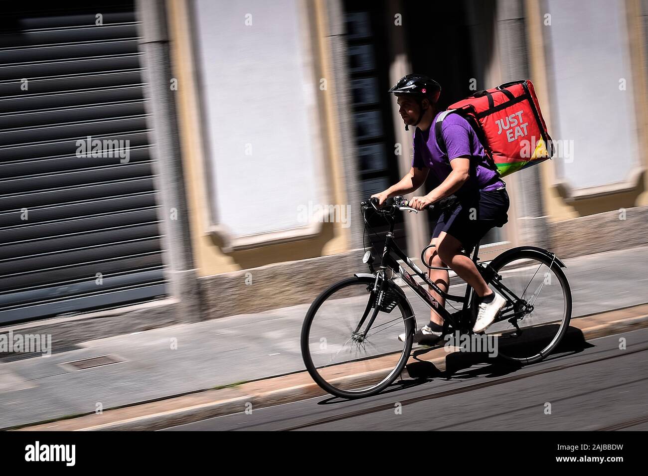 Turin, Italy - 13 June, 2019: A Just Eat courier rides during his work. Just Eat is a online food  delivery app (as Glovo, Uber Eats and Foodora) that use food riders as independent contractors. Credit: Nicolò Campo/Alamy Live News Stock Photo