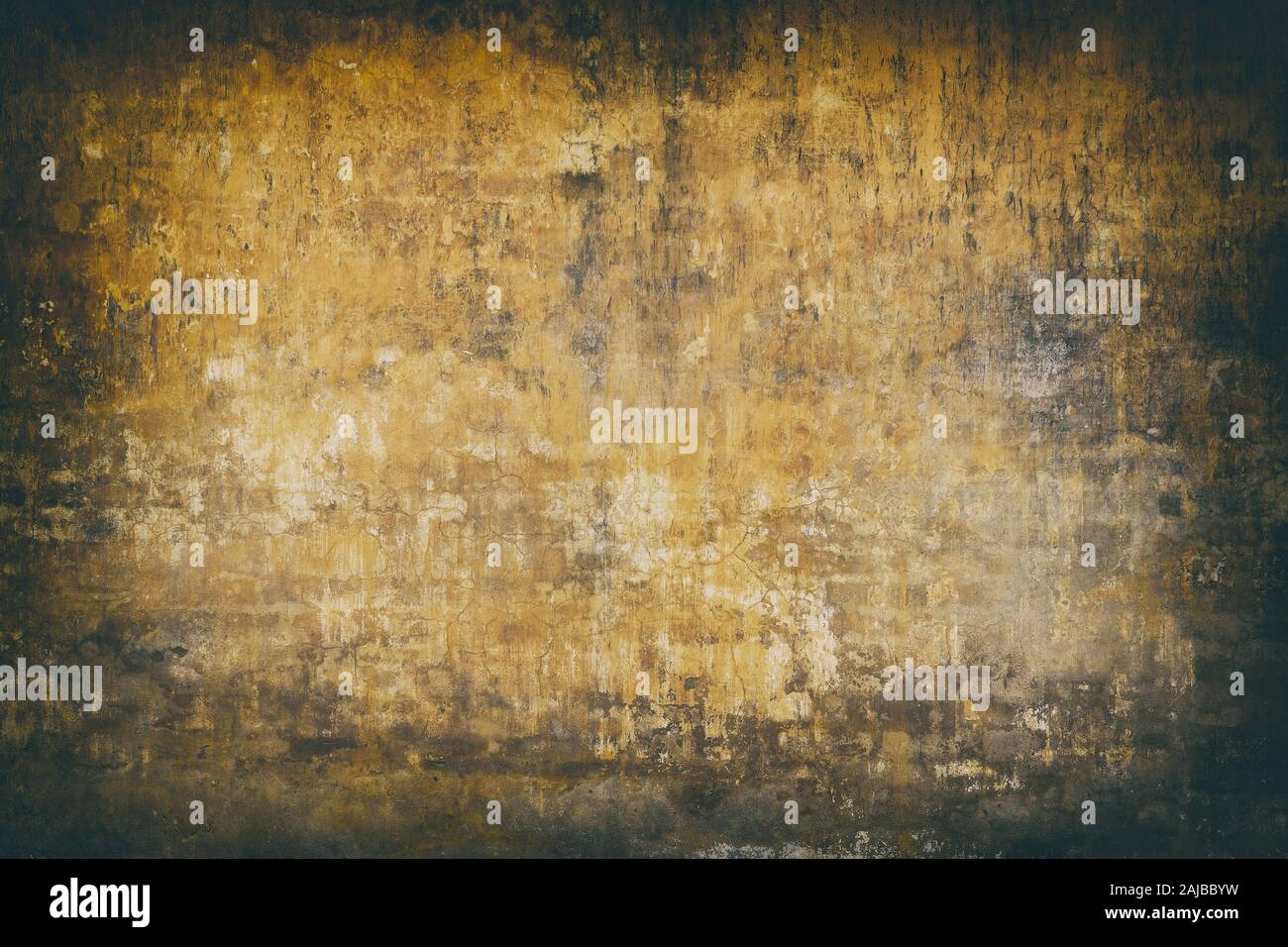 Real wall background, grungy yellow texture. Stock Photo