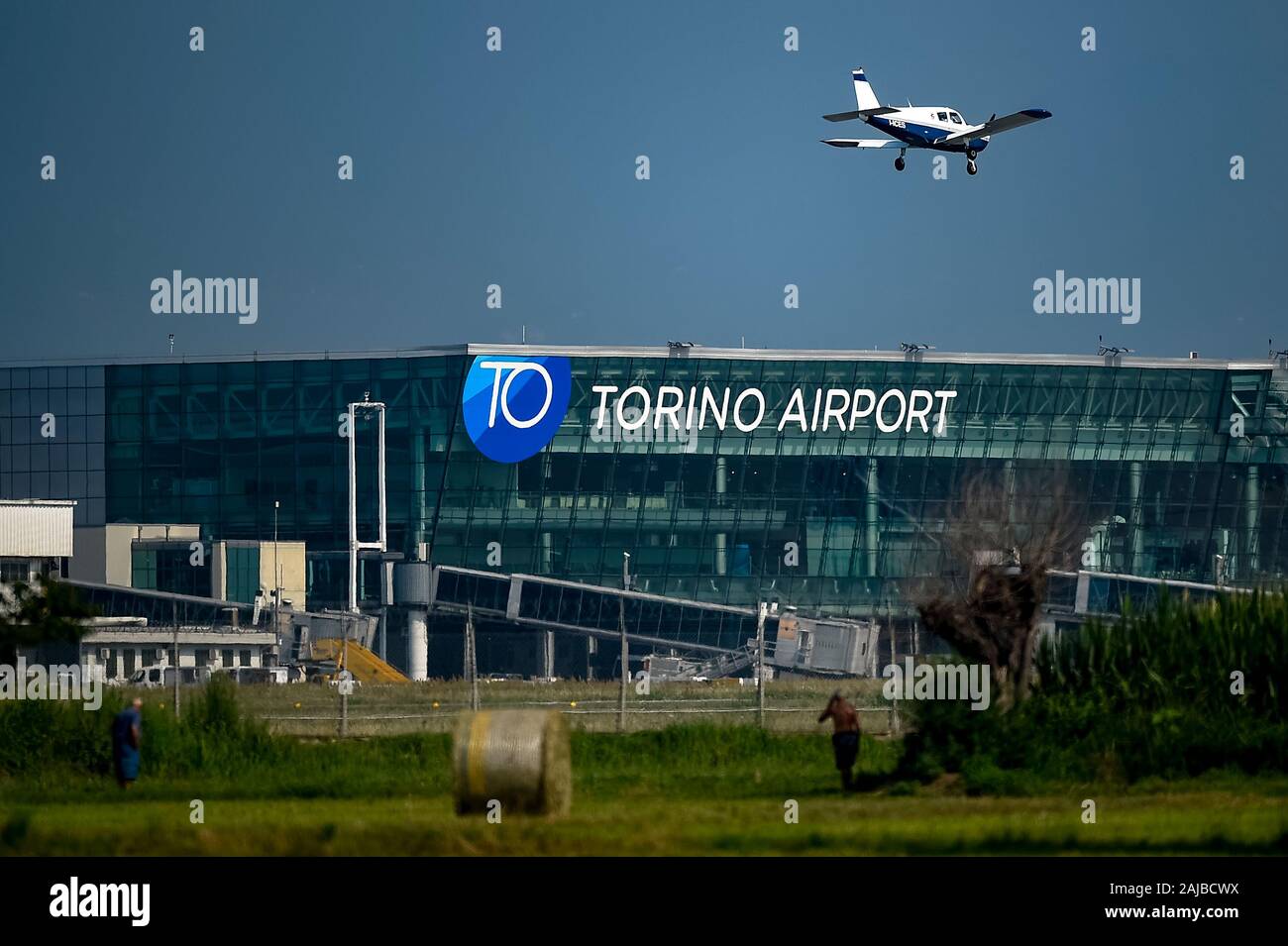 Caselle Italy 24 July 2019 A private plane approaches Turin Airport also known as Turin Caselle Airport and Sandro Pertini Airport On 24 July 2019 Italian trade unions call a strike action