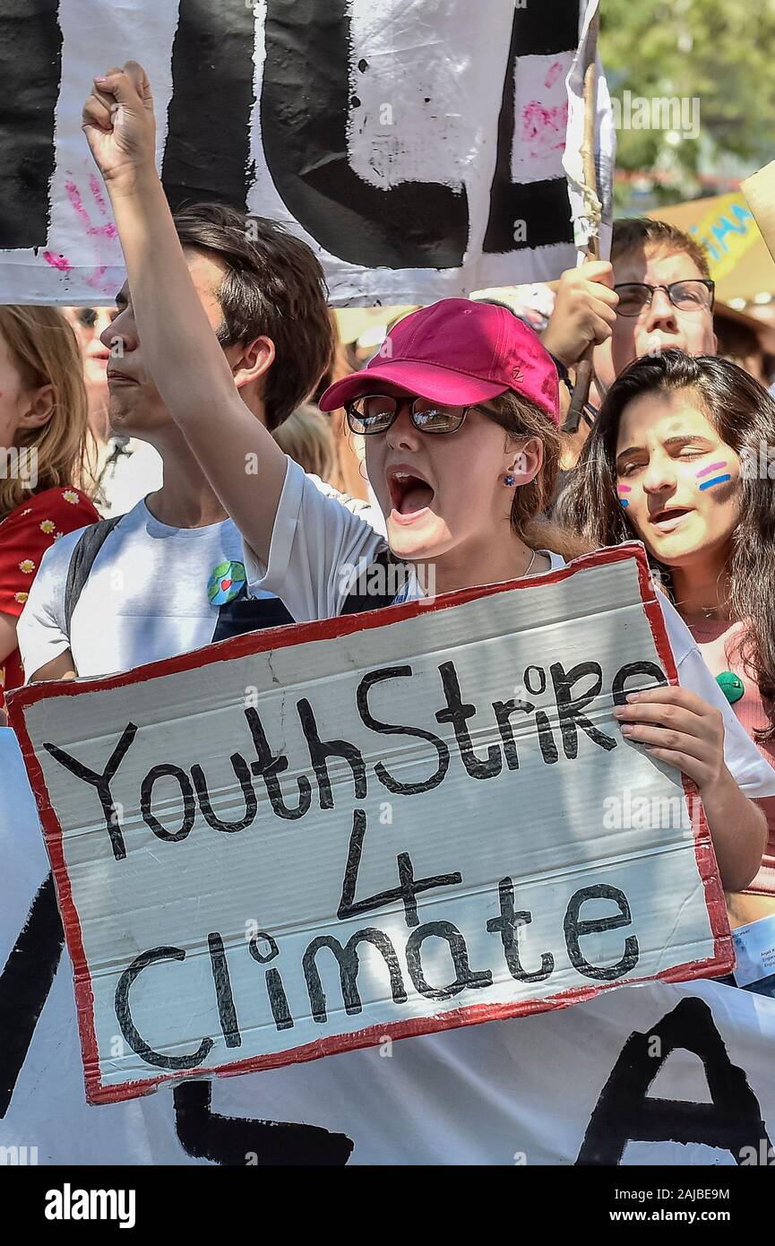 Lausanne, Switzerland - 09 August, 2019: A climate activist holds a sign reading 'Youth Strike 4 Climate' during a Fridays For Future strike for climate protection that is part of 'SMILE for Future' event. More than 450 young climate activists from different European countries gathered to attend the summit 'SMILE for Future', that stands for Summer Meeting in Lausanne Europe. The aim of the summit is to reinforce the links between the participants of the European Youth Climate Strike movement and to define the future of the mobilisation against climate change. Credit: Nicolò Campo/Alamy Live N Stock Photo