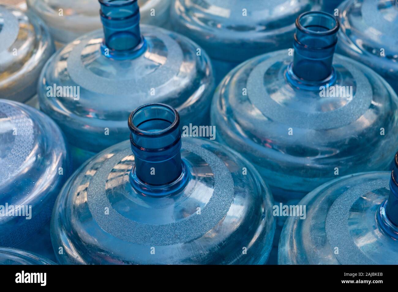 empty plastic canister bottles for water dispenser Stock Photo
