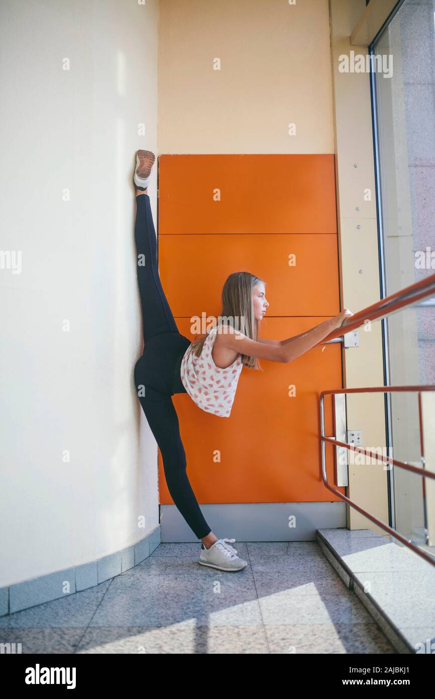 Athletic woman stretching legs hi-res stock photography and images - Alamy