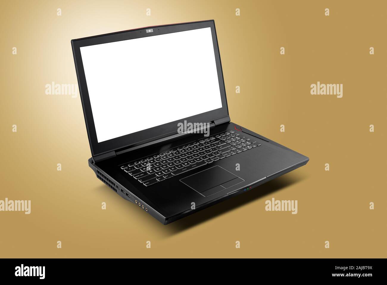 Front view of gaming laptop on golden yellow background. Laptop designed for gamers or professional players or 3d rendering Stock Photo