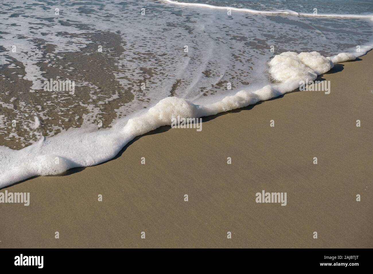 What's the funky brown sea foam washing up along the O.C. coast