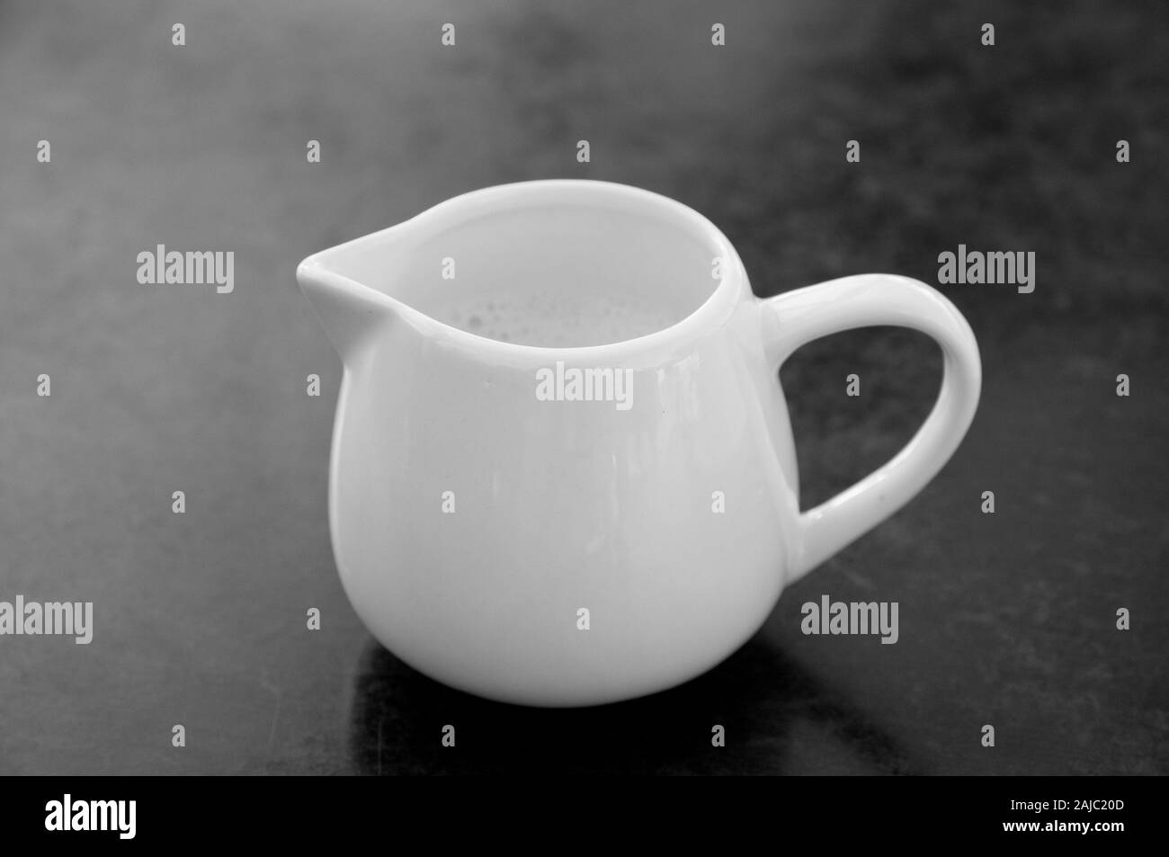 small pot of milk Stock Photo Alamy