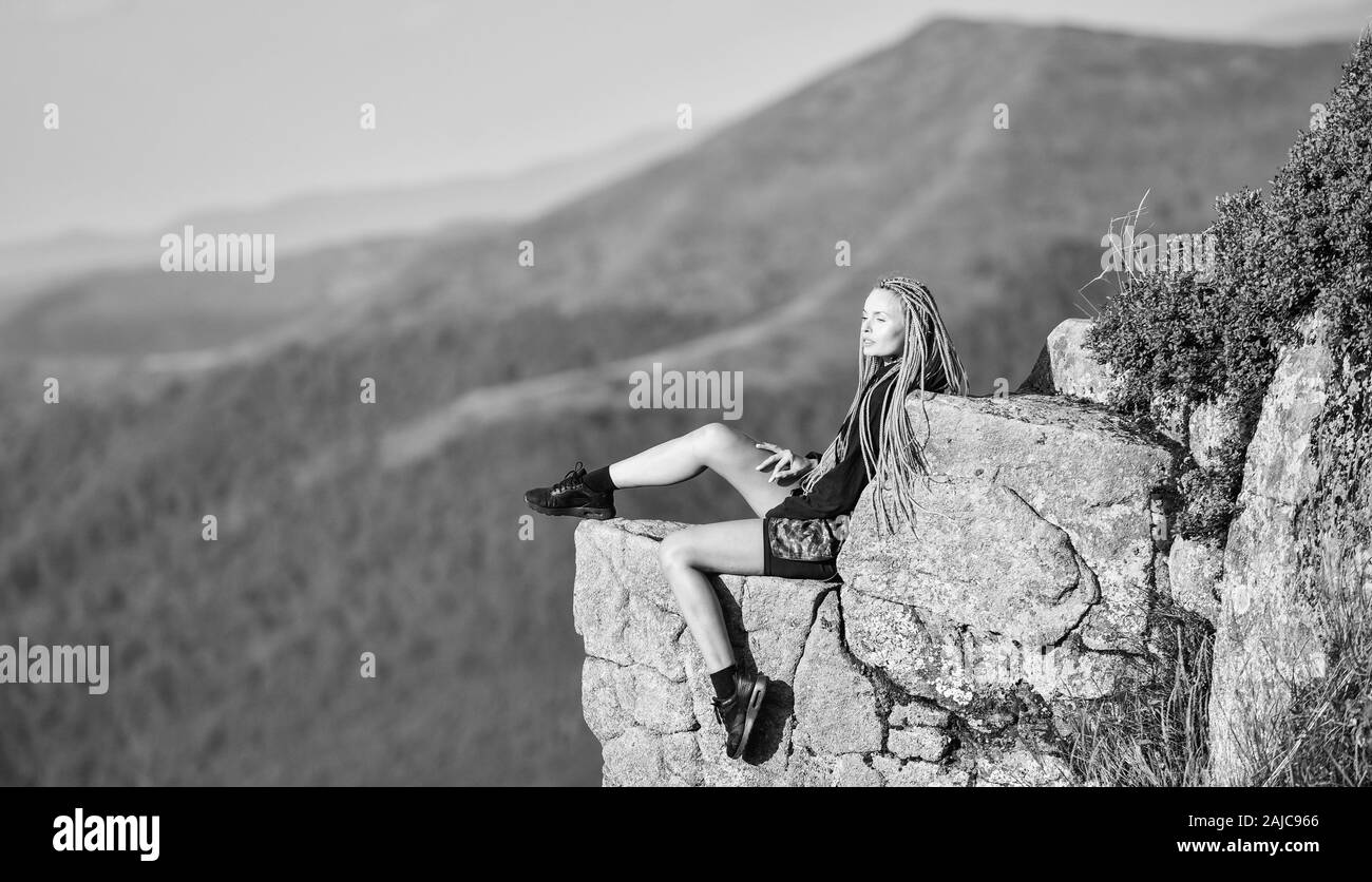 Girl Sitting On Edge Cliff High Resolution Stock Photography and Images