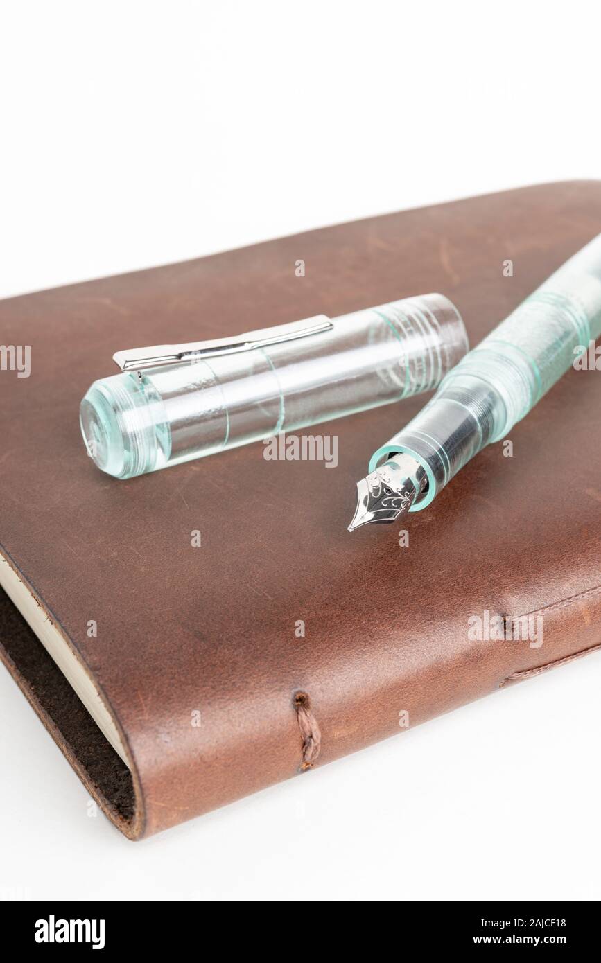 A simple but artful combination of classic leather-bound journal and ...