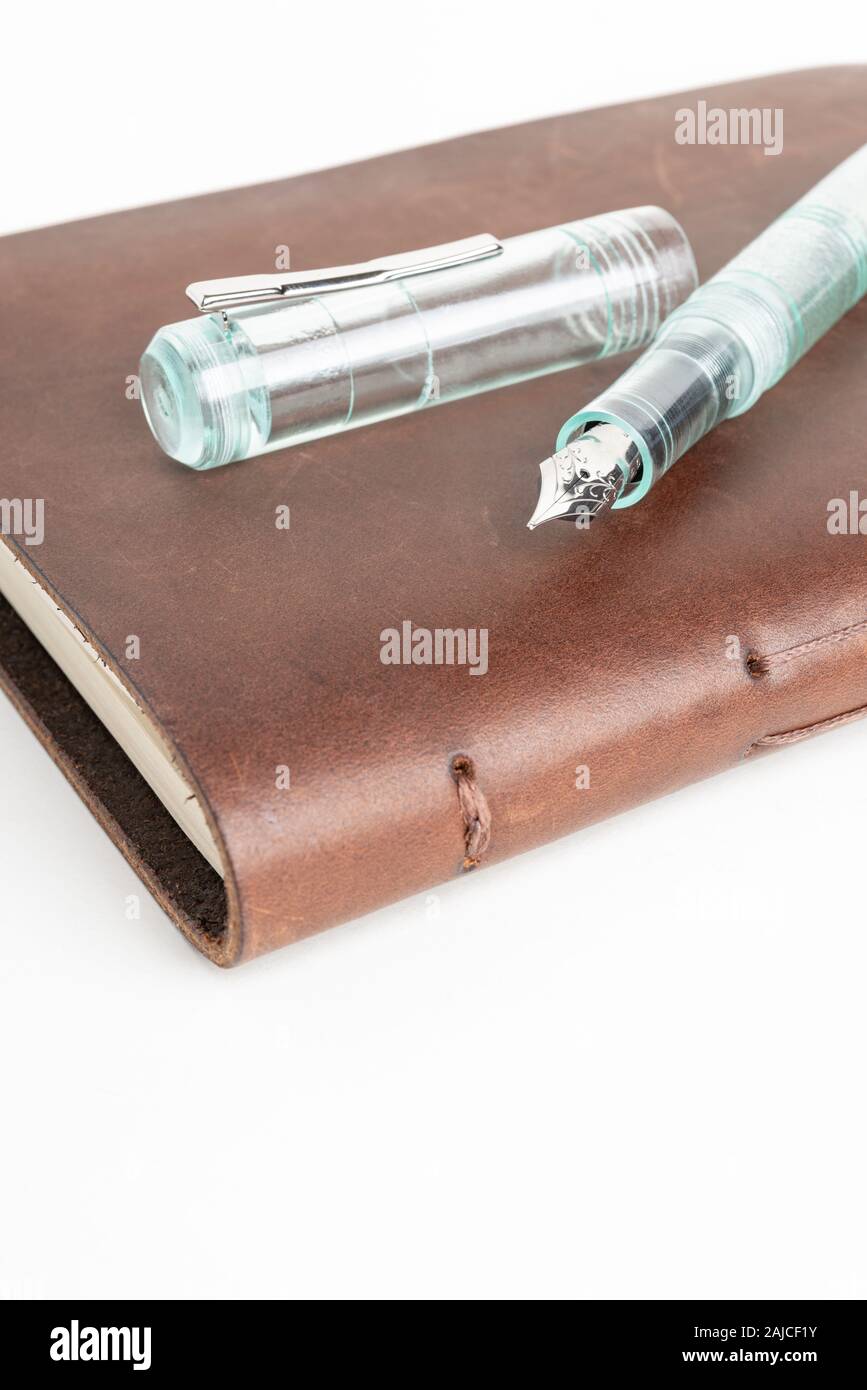 A simple but artful combination of classic leather-bound journal and ...