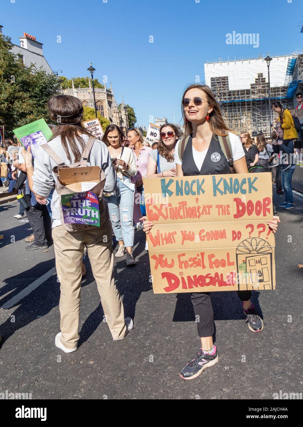 London / UK - September 20th 2019 - Extinction rebellion climate change activist holds a sign outside Parliament in Westminster Stock Photo