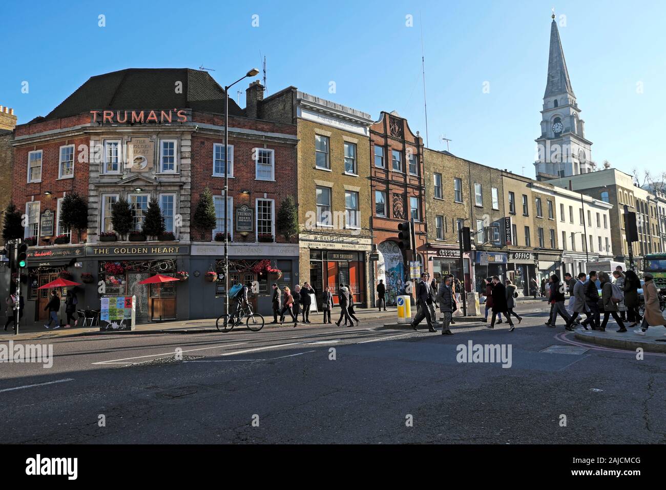 A view of Truman's pub, row terraced housing and Christ Church spire on Commercial Street in Spitalfields East London E1 England UK  KATHY DEWITT Stock Photo