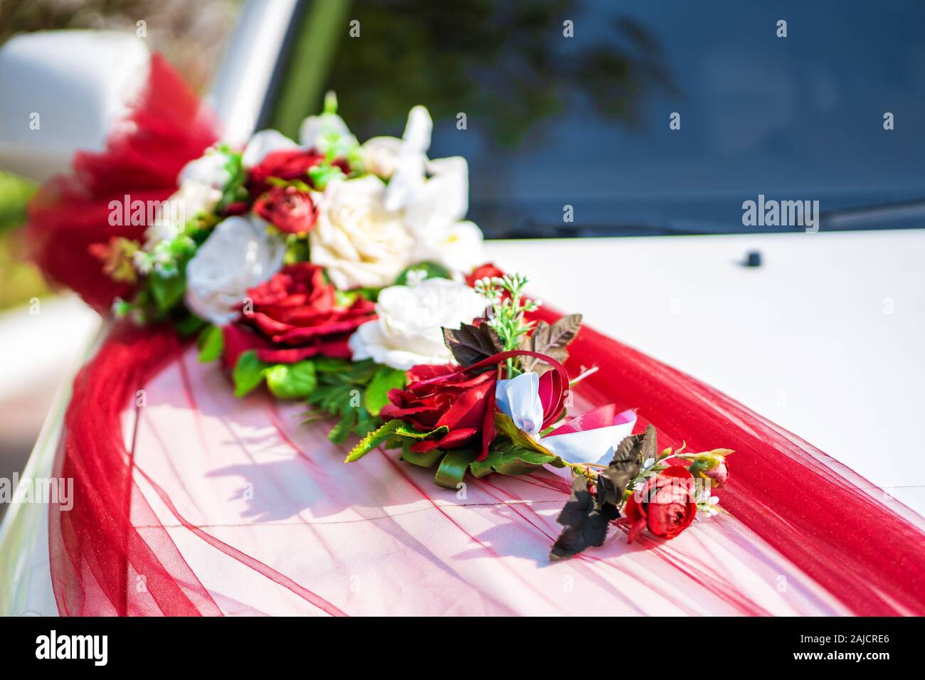 White wedding car decorated with fresh flowers. Wedding decorations Stock  Photo - Alamy