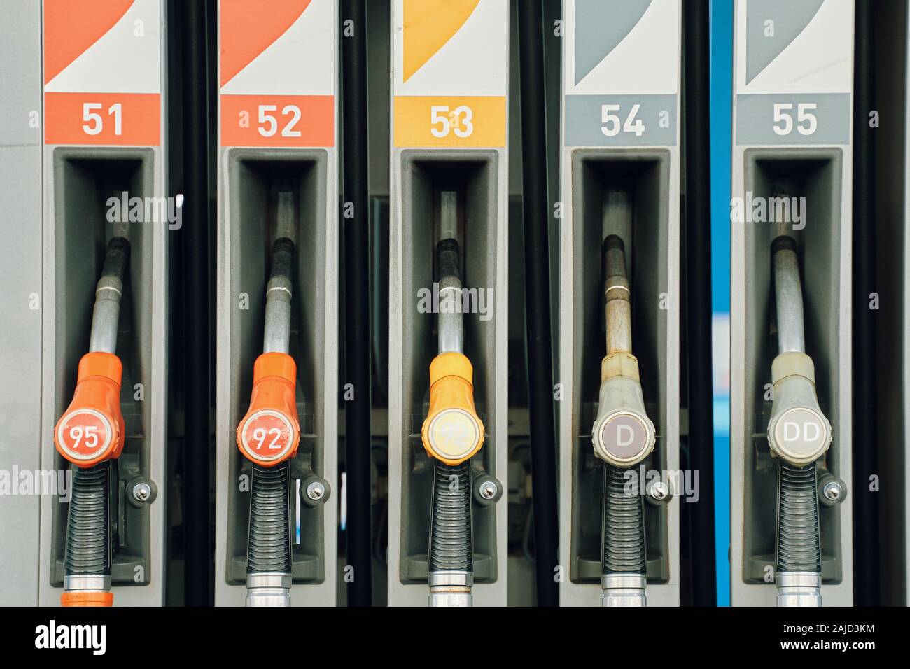 Gas station. Colorful Petrol pump filling nozzles Stock Photo Alamy