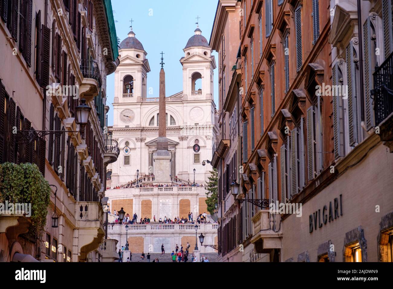 Spanish Steps view from Via dei Condotti at dusk, tourists and Trinita dei Monti Church, Rome, Italy Stock Photo