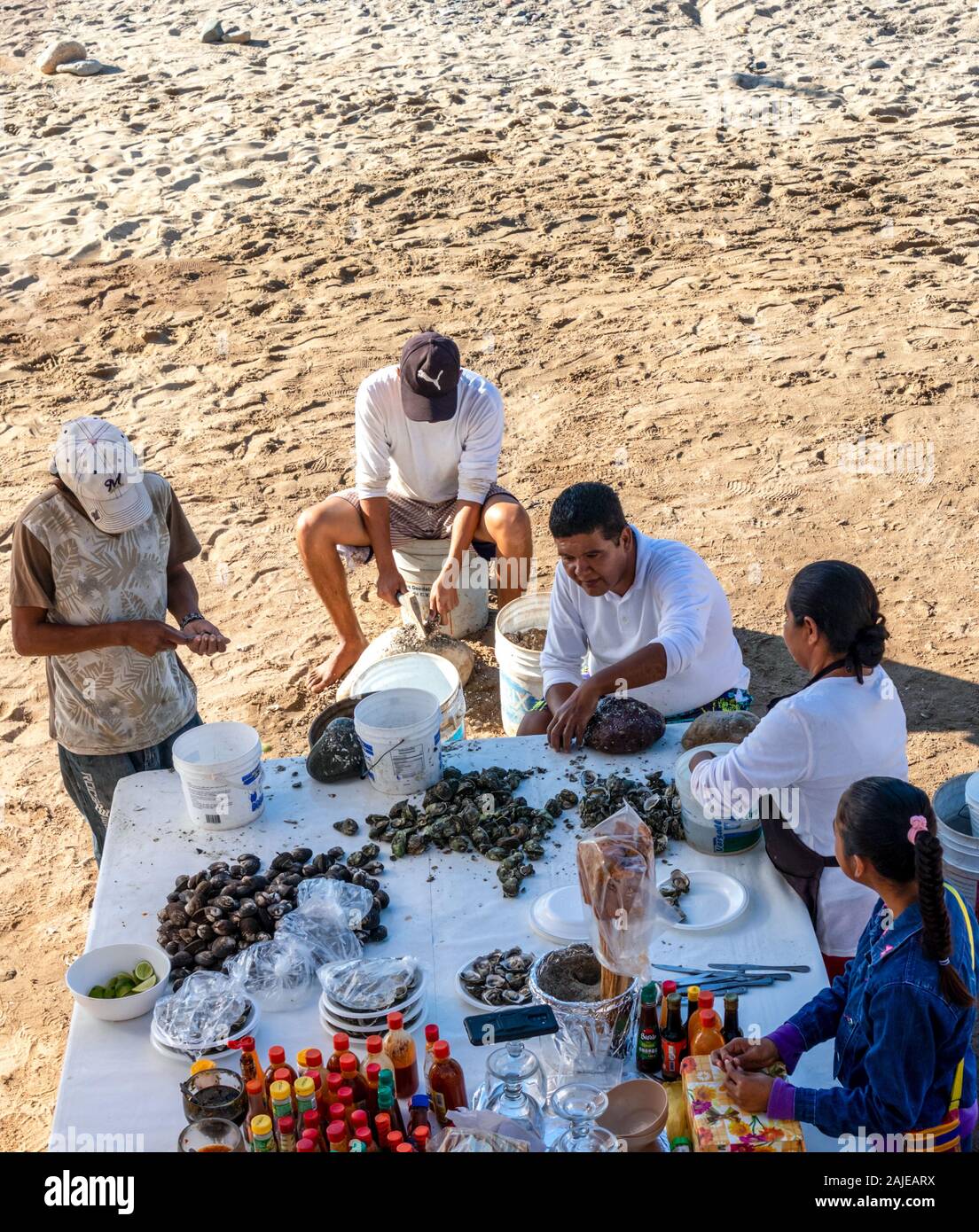 Puerto Vallarta Jalisco Mexico December 23 19 People Preparing Oysters On The Beach Of Puerto Vallarta Stock Photo Alamy
