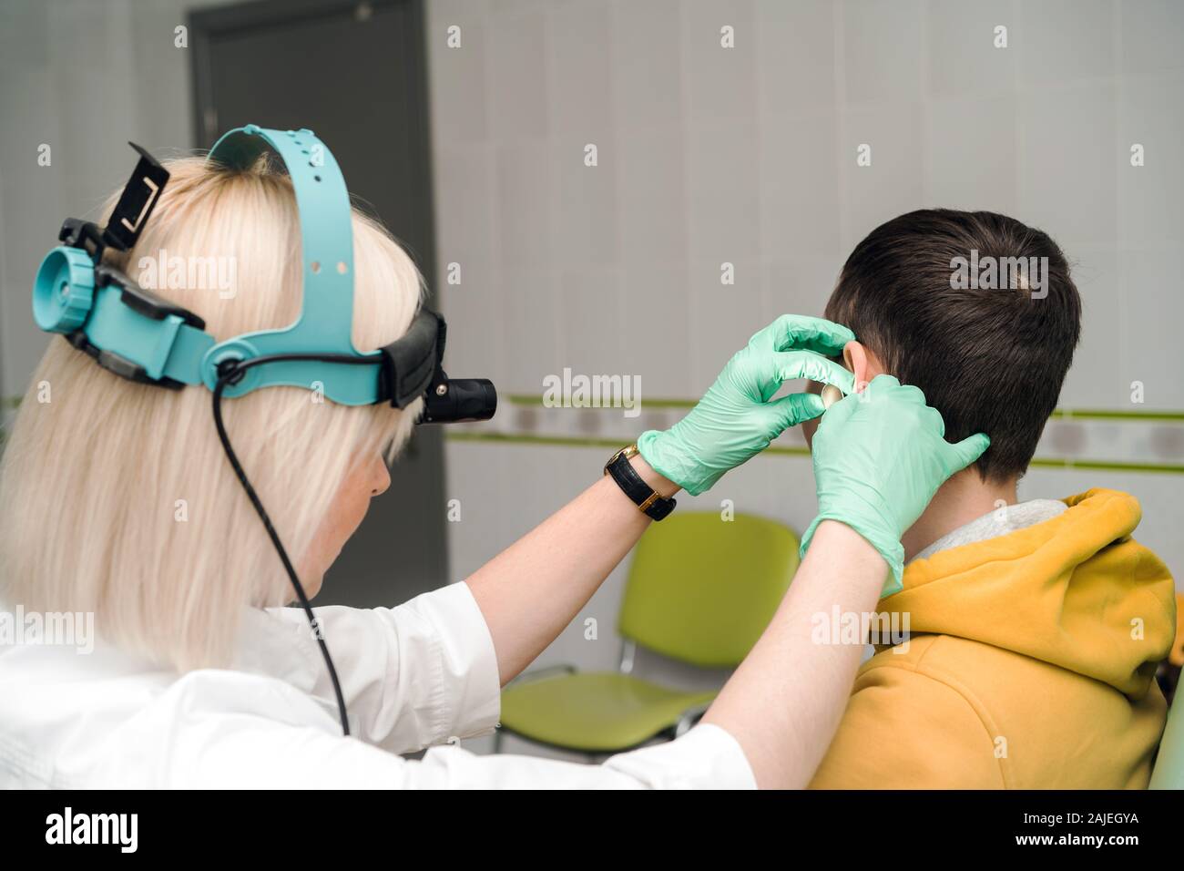 Preventive examination of a teenage boy in a medical facility.  Stock Photo