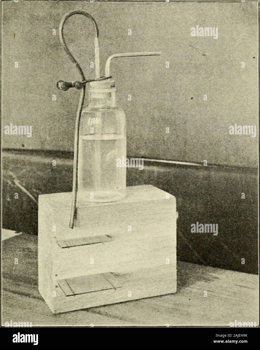 Field, laboratory, and library manual in physical geography . rble soluble in water? Put some ofthe powdered marble in a small beaker and fill the beaker withwater. Lead a tube from a carbon dioxide generator into thisbeaker of water and let the gas slowly bubble up through Fig. 26. A Beaker ar-ranged, for the Forma-tion of Crystals of Alum VEINS 137 the water. Continue this process for a day or two. Againpour off the water, filter, and evaporate to dryness. Doyou find any residuein the evaporatingdish? Is marble solu-ble in water which hascarbon dioxide in it?Water with carbondioxide is respo Stock Photo
