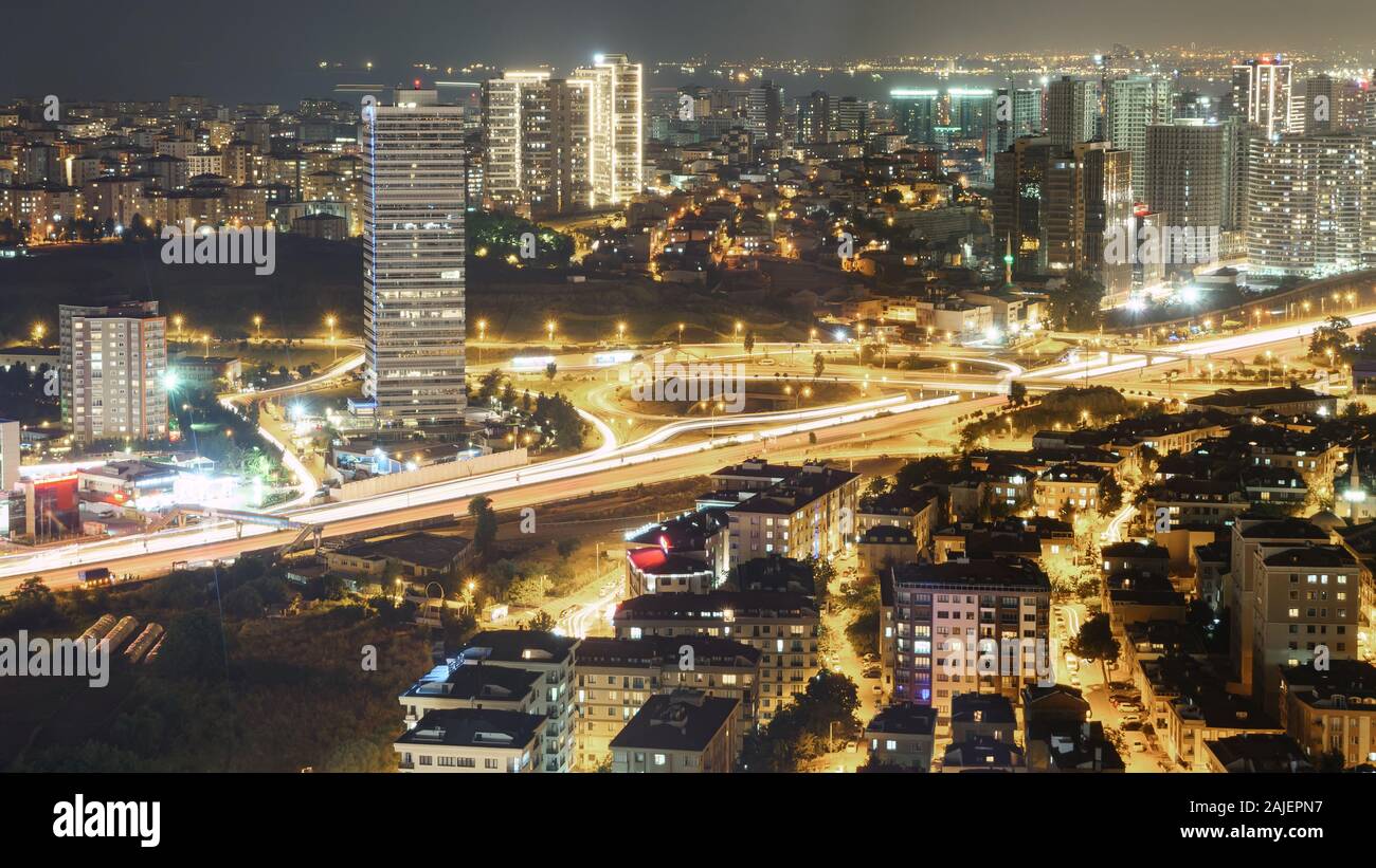 Night over the downtown with city lights. Aerial panoramic view of