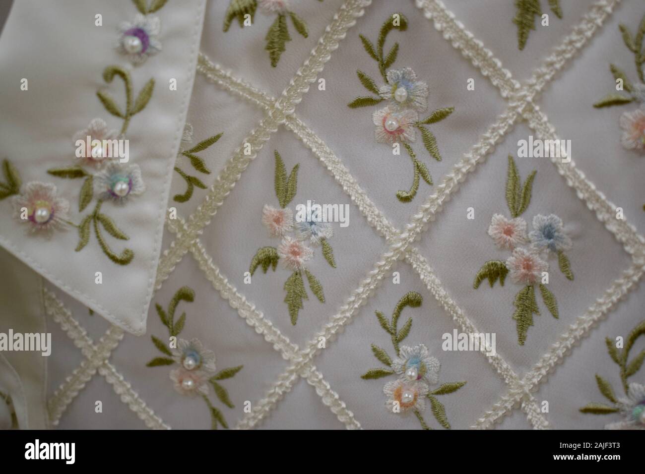 Delicate embroidery and beading create a floral pattern. Stock Photo