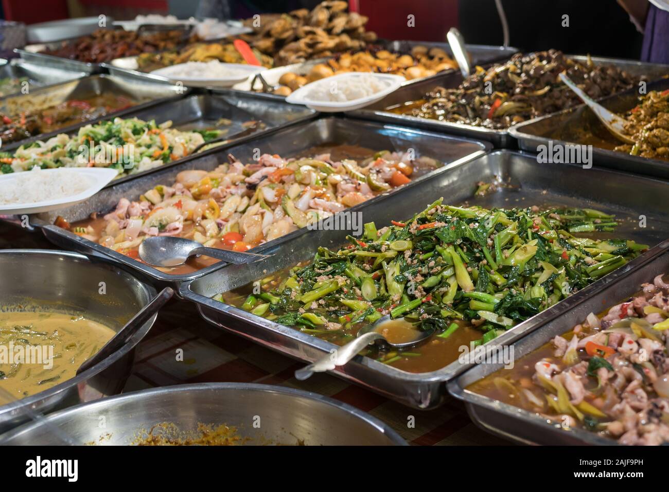 Various types of dishes selling at the food court Stock Photo ...
