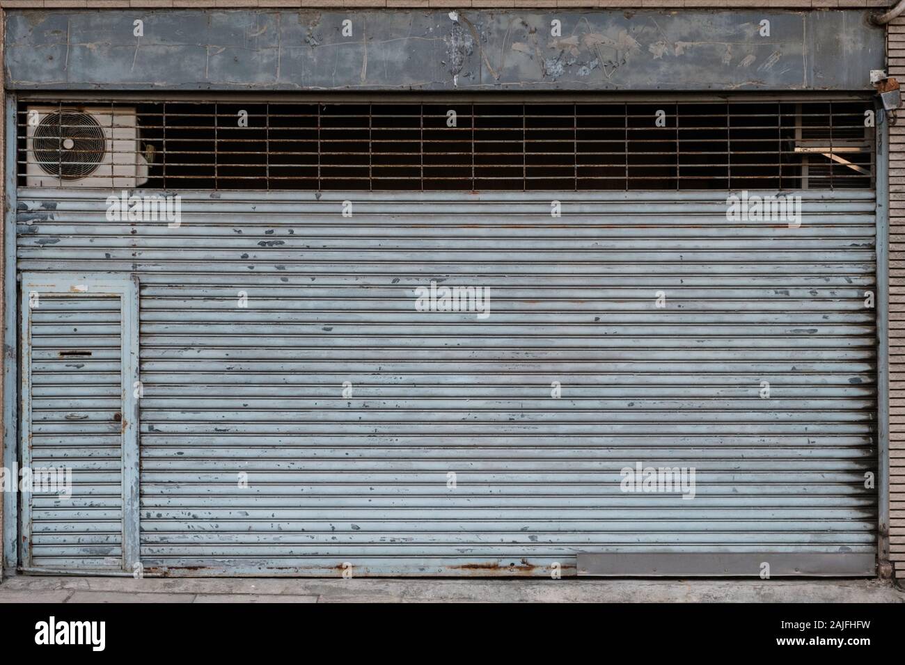 vintage store or shop with closed metal shutter Stock Photo