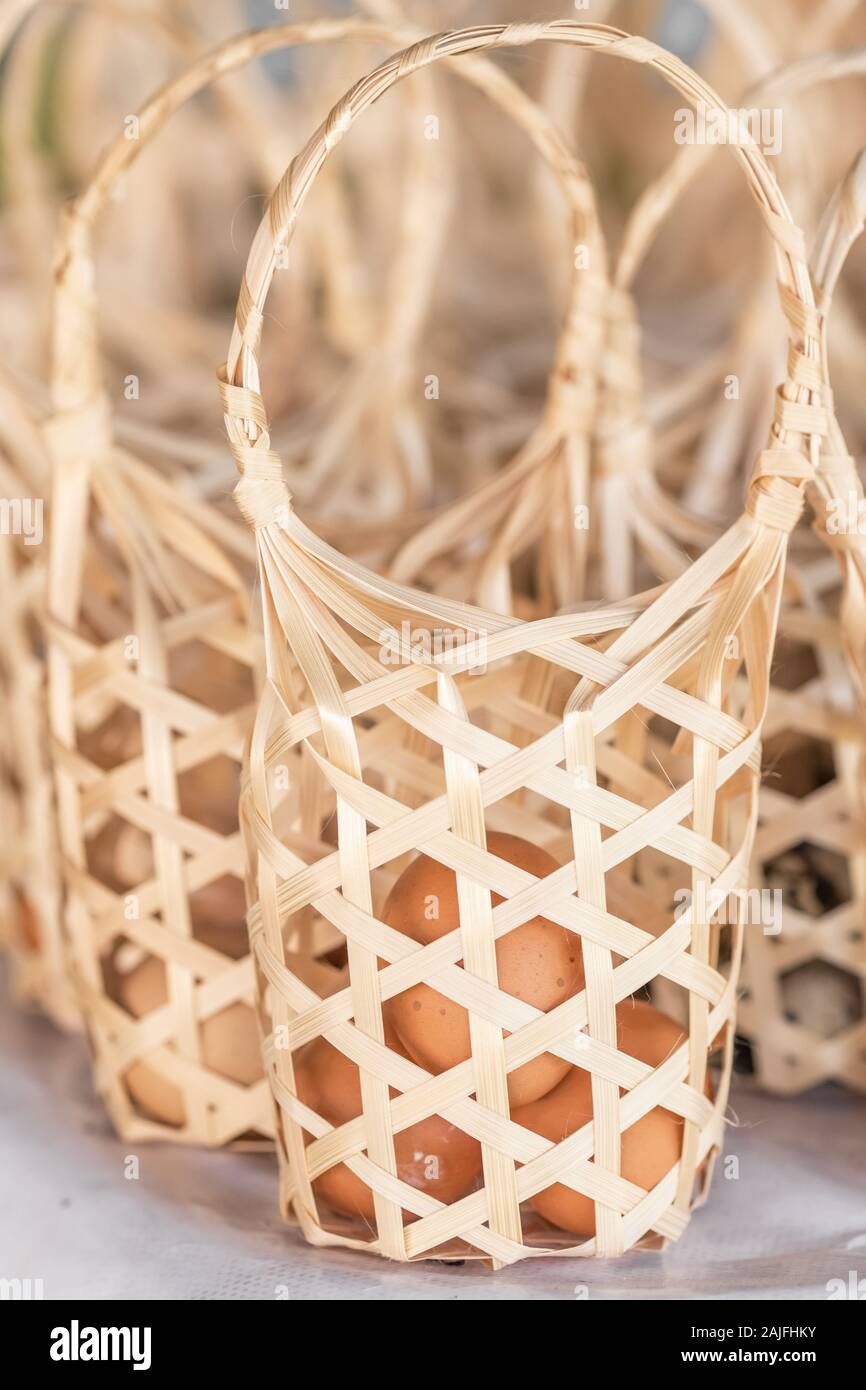 Eggs in bamboo basket ready to be boiled in hot springs, Thailand Stock Photo