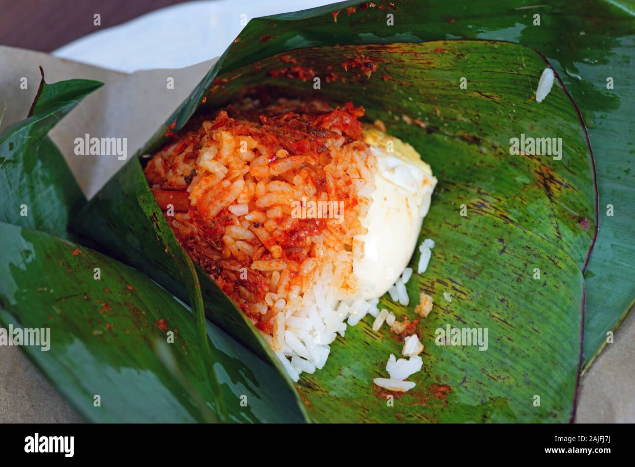 Pyramid Of Malaysian Nasi Lemak Fragrant Rice Wrapped In Pandan Leaf And Paper Stock Photo Alamy