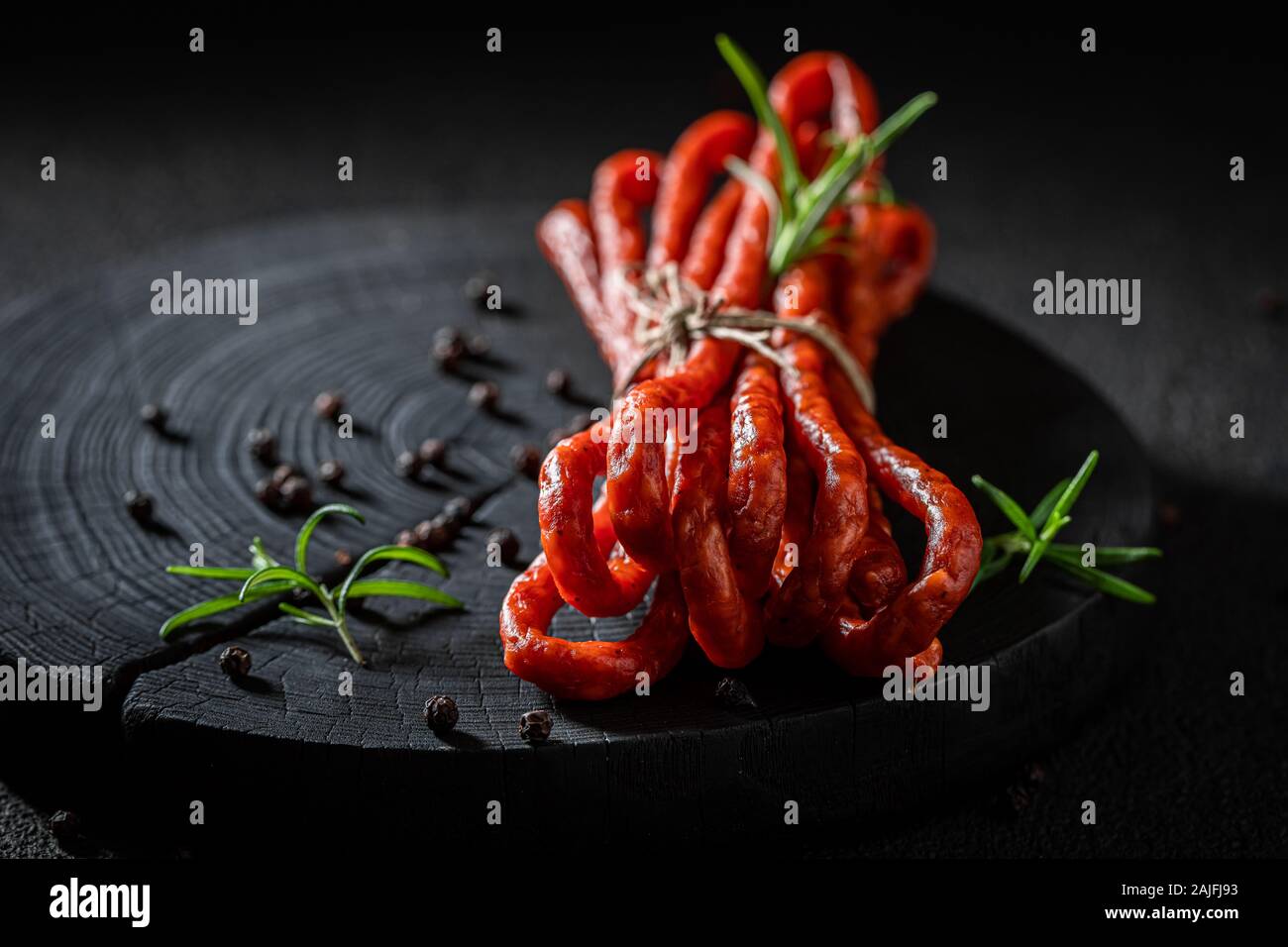Tasty kabanos with rosemary and black paper Stock Photo - Alamy