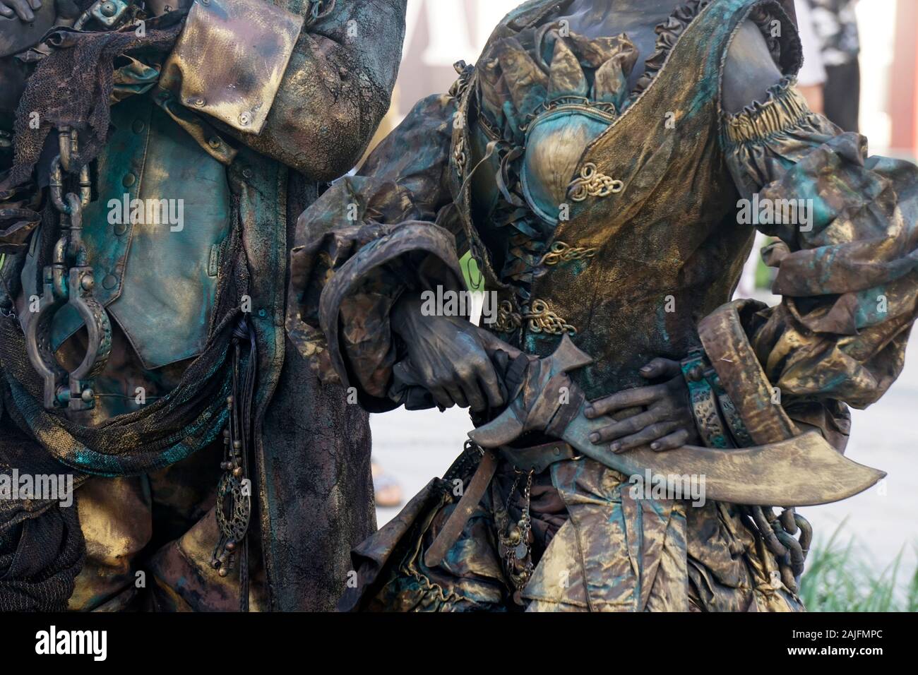 Details of Living statue of two pirates. Woman and man dressed in