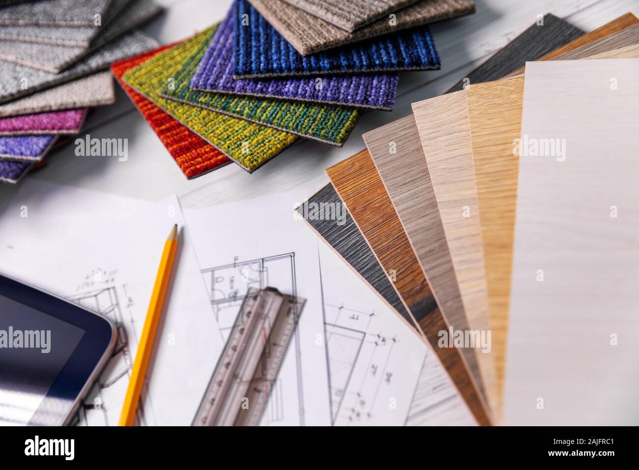 flooring and furniture materials - floor carpet and wooden laminate samples for interior design project Stock Photo